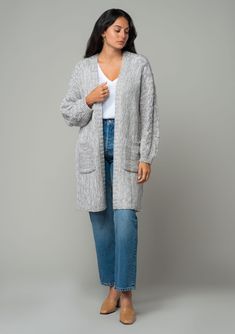 A cozy chunky knit cardigan with braided cable knit detail. FINAL SALE Chunky knit cardigan Relaxed fit Long sleeve with braided cable knit accent Mid-length Open front Side pockets Fall cardigan Your fall and winter wardrobe isn't complete without this chunky knit cardigan. With its cozy long sleeves and braided cable knit accents, it's the perfect blend of comfort and style. The open front and side pockets make it as practical as it is chic. Whether you’re layering over denim or draping it ove Gray Cable Knit Sweater Coat For Fall, Cozy Cable Knit Winter Cardigan, Winter Cable Knit Sweater Coat, Cable Knit Cardigan For Fall And Cold Weather, Oversized Gray Cable Knit Cardigan, Cozy Gray Cable Knit Sweater Coat, Cable Knit Sweater Coat For Cold Weather, Oversized Gray Cable Knit Outerwear, Cozy Cable Knit Sweater Coat For Layering