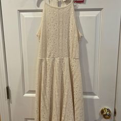 Brand New Cream Colored Halter Dress. It Is Fully Lined And Has A Lace Pattern. There Is A Keyhole Button Close In The Back. Size M. Cream Knee-length Lace Dress For Summer, Knee-length Cream Lace Dress For Summer, Casual Cream Lace Mini Dress, Casual Lace Midi Length Dress, Casual Knee-length Lace Dress, Casual Beige Lace Mini Dress, Casual Cream Lace Dress, Casual Lace Midi Dress For Day Out, Summer Lace Dresses For Daytime