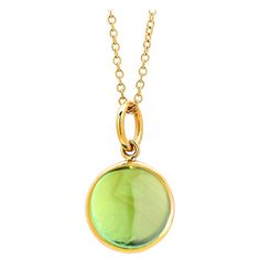 Created in 18 karat yellow gold 10 mm size charm Peridot 3.5 cts approx August Birthstone Chain sold separately Crafted from 18 karat yellow gold and measuring 10mm in size, this decadent pendant is adorned with a beautiful aquamarine gemstone weighing approximately 3.5 carats, making it the perfect March birthstone gift. Note the chain is sold separately. About the Designers ~ Dharmesh & Namrata Drawing inspiration from little things, Dharmesh & Namrata Kothari have created an extraordinary and Formal Yellow Gold Peridot Necklaces, Formal Yellow Gold Peridot Necklace, Yellow Gold Briolette Charms Jewelry, Gold Necklace With Round Peridot Pendant, Gold Peridot Round Pendant Necklace, Luxury Gold Peridot Jewelry, Luxury Gold Jewelry With Peridot, Luxury Yellow Gold Peridot Jewelry, Yellow Gold Cabochon Round Pendant Jewelry