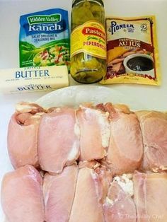 raw chicken and other ingredients laid out on a counter