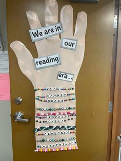 a bulletin board with words on it that say we are in our reading era and hand