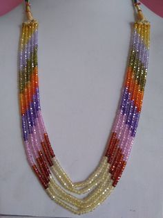 multicolored beaded necklace displayed on mannequin