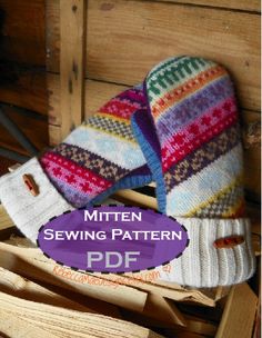 two mittens sitting on top of wooden boxes with the text mitten sewing pattern