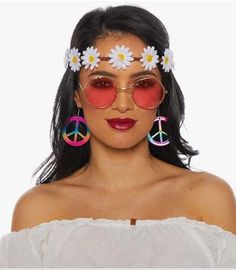 This women's hippie kit includes plastic multi-colored peace hook earrings, rose colored glasses and a groovy headband with fabric daisies. It fits most teens and adults. Perfect for Halloween, cosplay, theme parties, watch parties, theatrical productions and so much more! Other 1960's and 1970's costumes and accessories are sold separately on our page - subject to availability. Adjustable Costume Accessories For Summer Festival, Fun Adjustable Festival Costume Accessories, Fun Adjustable Costume Accessories For Festival, Adjustable Fun Costume Accessories For Festival, Paz Hippie, Hippie Makeup, Looks Hippie, Hippie Accessories, Carnaval Costume