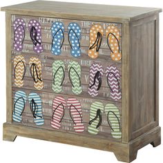 a wooden cabinet with flip flops painted on it