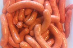 a pile of hotdogs sitting on top of each other