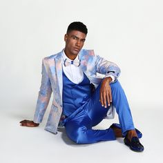 Elevate Your Style With The Tazio Textured Gradient Tie Dye 3-Piece Suit Set, A True Masterpiece Of Modern Elegance. This Suit Is Designed To Make You Stand Out, From Its Unique Gradient Tie-Dye Pattern To Its Impeccable Skinny Fit, Peak Lapel, And Thoughtful Features Like Underarm Sweat Guards. The Satin Solid Color Pants With A Flat Front, Paired With A Double-Breasted Vest And A Striking Bowtie, Complete This Sophisticated Ensemble. With Its Tailored Precision And Eye-Catching Design, Tazio E Bright Colored Suits For Men, Elegant Blue Summer Suits, Formal Fitted Pink Sets, Pink Fitted Sets For Formal Occasions, Tailored Blue Summer Suits, Blue Slim Fit Party Sets, Fitted Suits For Summer Parties, Blue Summer Semi-formal Suits, Fitted Satin Suits For Spring