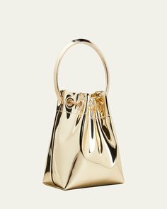 Jimmy Choo bucket bag in metallic faux leather, fabric, and brass hardware    Metal ring top handle, 3.5" drop    Detachable chain shoulder strap, 21.5"L    Drawstring closure with chain tassels     Fabric lining     Approx. 5.9"H x 5.5"W x 3.7"D    "Bon Bon" is made in Italy Luxury Gold Top Handle Bucket Bag, Gold Bucket Bag With Top Handle And Gold-tone Hardware, Gold Bucket Bag With Metal Hardware, Luxury Gold Bucket Bag For Formal Occasions, Luxury Party Bucket Bag With Gold-tone Hardware, Evening Handheld Bucket Bag With Gold-tone Hardware, Formal Bucket Bag With Gold-tone Hardware, Gold Bucket Bag With Detachable Handle For Evening, Elegant Bucket Evening Bag With Gold-tone Hardware