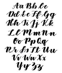 handwritten alphabet in black ink on white paper