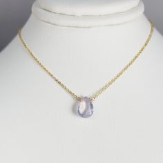 Add a touch of elegance with this handmade necklace, featuring a natural Lavender Quartz gemstone dangling in a handmade frame on a simple dainty chain. Choose your length for a choice to wear it as a choker or a long layered necklace. Simple, minimal, and elegant all-in-one necklace. Makes a great gift to add to any gemstone lover's collection. Perfect to gift for Christmas, Valentine's Day, Mother's Day, and more! Gemstone: Lavender Quartz, Scorolite Gemstone Size: 10.0 mm Gemstone Shape: Pan, Fine Jewelry Handmade Teardrop Necklace, Elegant Purple Necklace With Delicate Chain, Elegant Lavender Drop Necklaces, Delicate Gemstone Necklaces For Jewelry Making, Delicate Everyday Gemstone Necklaces, Handmade Delicate Necklace With Teardrop Pendant, Delicate Gemstone Necklaces For Everyday, Elegant Drop Necklace With Natural Stones And Teardrop Pendant, Handmade Elegant Drop Crystal Necklaces