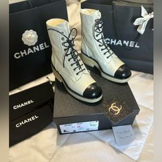 Bnib Chanel 22a Pearlized Grained Calfskin Lace Up Combat Boots Cctoe Size 38.5 (I Went Up A Half Size With Socks And Chanel Is Known For Running Small) Originally $1792 W/Tax -Selling For $ Original Owner Never Worn Bought From Chanel Boutique Brand New In Box Includes: -2 Dustbags -Ribbon -Camellia Flower -Shoe Box -Some Of Receipt Serial Number: G39162 Chanel Booties, Chanel Combat Boots, Suede Combat Boots, White Combat Boots, Chanel Boots, Chanel Boutique, Lace Up Combat Boots, Black Combat Boots, Flower Shoes