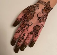 a henna design on the palm of someone's hand