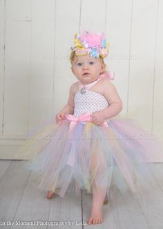 This listing is for the Easter Pastel Tulle Tutu Dress in light pink, baby blue, pastel yellow, and lavendar with a satin halter tie as pictured in your choice of size.  Matching Over the Top Bow and Headband set is optional.  DETAILS:- double layered tutu for extra fluff- headband and bow are optional- 0- 6 months- 12" length from top to bottom of dress - 6-12 months- 15" length from top to bottom of dress- 12-24 months- 18" length from top to bottom of dressCustomize a beautiful baby, infant, Pink Princess Tutu Dress For Cake Smash, Princess Pink Tutu Dress For Cake Smash, Sweet White Tutu Dress For First Birthday, White Tulle Tutu Dress For Easter, Pink Tulle Tutu Dress For Cake Smash, Spring Pink Tutu Dress For Cake Smash, Cute First Birthday Tutu Dress With Tulle Skirt, Sweet Tutu Dress For Cake Smash, Whimsical Tulle Tutu Dress For First Birthday