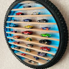 a wall mounted toy car display with wooden shelves