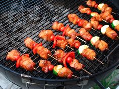 chicken and vegetable skewers are cooking on the grill