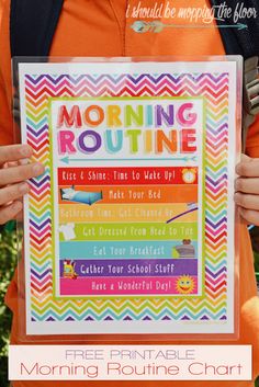 a person holding up a poster with the words morning routine written on it in front of them