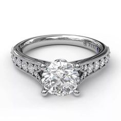 a white gold engagement ring with diamonds on it