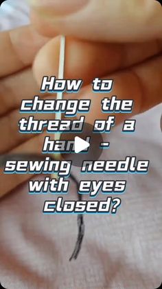 someone is trying to change the thread of a hand sewing needle with eyes closed?