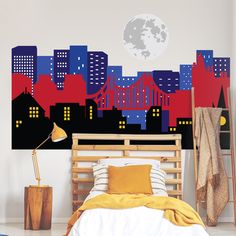 a bedroom with a city skyline painted on the wall