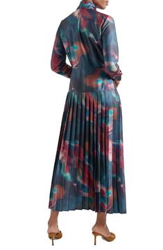 A drapey tie-neck detail tops this long-sleeve maxi dress boasting a dropped waist and a brilliantly pleated skirt on sumptuous crêpe de Chine. Fold-over tie neck Long sleeves with button cuffs 100% polyester Hand wash, line dry Imported Flowy Pleated Maxi Dress For Fall, Evening Maxi Dress With Pleated Sleeves For Fall, Multicolor Long Sleeve Maxi Dress For Evening, Elegant Flowy Maxi Dress For Fall, Spring Silk Long Sleeve Maxi Dress, Spring Silk Maxi Dress With Long Sleeves, Flowy Long Sleeve Maxi Dress, Chic Long Sleeve Silk Maxi Dress, Flowy Long Sleeve Maxi Dress With Pleated Sleeves