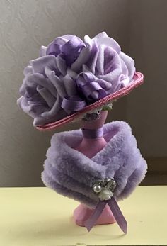 there is a purple hat with flowers on it