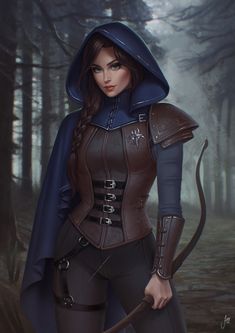 a woman in a hooded outfit with a bow and arrow is standing in the woods