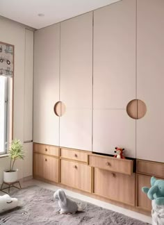 a bedroom with white walls and wooden furniture in the corner, along with an animal rug on the floor