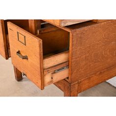 an old wooden desk with two drawers