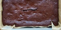 a chocolate cake sitting on top of a metal pan