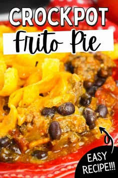 the crockpot frito pie is on a red plate with black beans and cheese