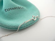 Overview:Offered for sale is a gorgeous Tiffany Picasso Sterling Silver and Diamond Modern Heart necklace - in a longer length - 19.75 Inches! The necklace is a wonderful piece that is simple, elegant, and classic all rolled into one. It works perfectly with pretty much any attire your put on, AND adds a nice feminine touch to it. Hanging from its bright Tiffany silver curb chain is a very pretty Modern heart charm with a diamond center that sparkles nicely as it catches the light! It is a wonde Elegant Heart Pendant Necklace With Hallmarks, Diamond Heart Necklace, Modern Heart, Heart Necklace Diamond, Gift Love, Long Chain, Diamond Heart, Tiffany & Co., Heart Charm