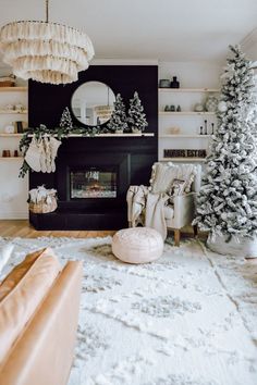 a living room decorated for christmas with white decorations