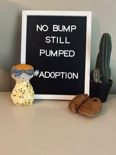 there is a sign that says no bump still pumped adoption next to some slippers