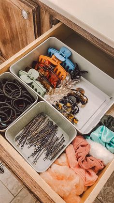 an open drawer filled with lots of crafting supplies