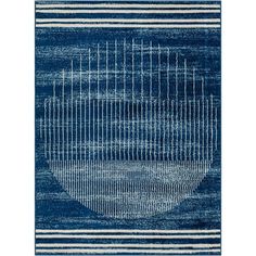 a blue and white rug with lines in the middle, on top of an area rug