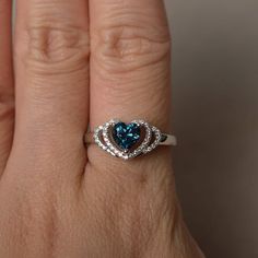 This is a gorgeous handmade creation. Its beauty is its simplicity & Elegance. The 6*6 mm heart cut faceted real London blue topaz is crafted in solid sterling silver and with rhodium plated. All item is sent in a beautiful gift box If you have any idea of design your ring,pls contact me directly. You can realize more lovely stuff clicking the link https://www.etsy.com/shop/knightjewelry?refshopsection_shophome_leftnav Please leave the correct address and you phone number for delivering succ Heart Cut Topaz Jewelry Perfect For Gifts, Heart Cut Topaz Jewelry As Gift, Heart Cut Topaz Jewelry For Gifts, Heart Cut Topaz Jewelry Gift, Sterling Silver Diamond Cut Topaz Promise Ring, Sterling Silver Diamond Cut Topaz Ring For Promise, Silver Heart Cut Topaz Ring Gift, Heart Cut Silver Topaz Ring For Gift, Heart Cut Blue Topaz Promise Ring