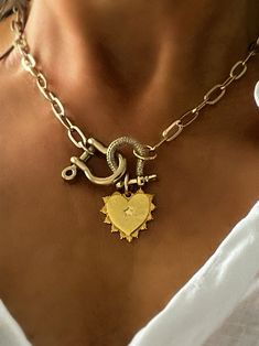 Heart charm 20mm x 25mm 24kt gold plated brass link chain 16" or 18" LOBSTER CLASP OPENING + All gold plated jewelry is plated with the highest quality and has a secondary coating; however, to further help preserve jewelry, please avoid water, lotion, perfumes and other liquids when wearing. Store jewelry in its microfiber bag and separate from other jewelry when not wearing. FOLLOW US ON SOCIAL MEDIA  INSTAGRAM lexi_andmaks Trendy Heart-shaped Charm Necklaces As Gift, Heart-shaped Tarnish-resistant Charm Necklace For Her, Gold Heart-shaped Tarnish-resistant Charm Necklace, Heart-shaped Charm Necklaces With Removable Charms, Heart-shaped 14k Gold Charm Necklace For Valentine's Day, Heart Shaped Pendant Necklace, Estilo Punk, 24kt Gold, Gold Plated Jewelry