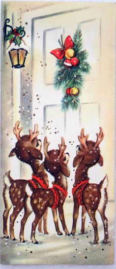 a group of reindeers standing in front of a door with christmas decorations on it