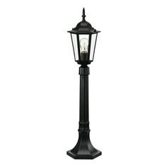 a black lamp post with a light on it's top and one light on the bottom