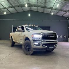 a large white truck parked in a garage