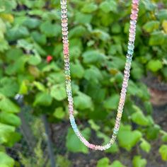 "Perfect tiny faceted globes in hazy shades of pink and green make for a necklace that almost verges on neutral, but on closer inspection reveals a galaxy of Spinelmaline colors. These are exceptional gemstones chosen specifically for their strange and complex color. Forest green and magenta are quieted by grey blues and cloudy lavender.  This necklace is about 18\" and finished with a solid gold spring ring, large enough to hang a charm." Multicolor Tourmaline Beaded Necklace With Faceted Beads, Pink Tourmaline Necklaces With Round Beads, Multicolor Tourmaline Faceted Beads Necklace, Pink Tourmaline Beaded Necklaces, Multicolor Faceted Tourmaline Necklaces, Sea Holly, Spring Rings, Gemstone Necklace, Forest Green