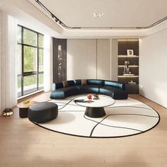 a modern living room with white walls and wood flooring, large sectional sofa set in center