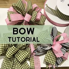 the bow is sitting on top of the table next to other bows and ribbon pieces