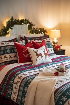 a christmas themed bed with red and green pillows