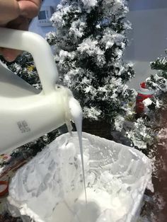 someone is pouring white liquid into a container