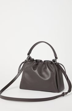 Soft leather is a refined material characterized by a natural grain and a nice supple hand. Drawstring closure Adjustable and detachable shoulder strap Handle Leather lining Internal pocket with zip closure Nickel-free monili decoration Bag is 25 cm (9.84") long, 8 cm (3.15") wide and 18 cm (7.09") high Elegant Formal Soft Leather Hobo Bag, Elegant Leather Hobo Bag With Detachable Strap, Formal Bucket Bag With Handle Drop, Elegant Bucket Bag With Detachable Strap And Double Handle, Elegant Satchel Bucket Bag With Detachable Strap, Timeless Formal Hobo Bag With Detachable Strap, Formal Hobo Bag With Adjustable Strap, Elegant Formal Bucket Bag With Handle Drop, Textured Leather Evening Pouch Bag