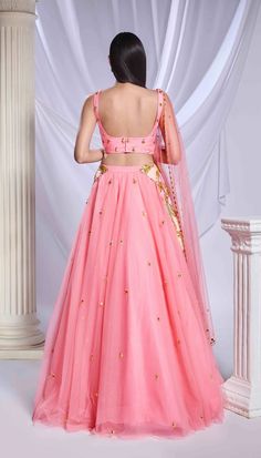 Our pink tulle lehenga is adorned with intricate patchwork embroidery and metallic accents cascading from the waist to the hips. The lehenga is embellished with scatter embroidery, featuring gold elements and delicate pink crystals throughout. Completing the ensemble is a sleeveless pink blouse featuring matching patchwork.From Papa Don’t Preach’s Bring Your Own Fairytale collection. DELIVERY TIMEPlease allow 8-12 weeks for your outfit to arrive. FABRIC DETAILSTulle Professional cleaning only. Engagement Sarees, Tulle Lehenga, Reception Sarees, Haldi Dress, Patchwork Embroidery, Bridal Jumpsuit, Wedding Jumpsuit, Pink Lehenga, Engagement Dresses