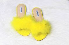 Stay comfy & stand out in these slip-on sandals. ~True to size Feather Sandals, Summer Slides, Yellow Feathers, Yellow Sandals, Summer Slide, Fur Slides, Sandals Summer, Slide Sandals, Slip On Sandal