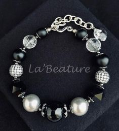 • Bracelet is made of black onyx gemstones (mix of shape and coatings) beads, rock crystal gemstone beads, cubic zirconia micro paved beads and bead caps, gunmetal spacer beads, silver tone hook clasp with an extender finished with Swarovski heart charm. • Bracelet is measuring 9.75 inches with an Elegant Onyx Beaded Bracelets With Black Beads, Elegant Black Bracelets With Faceted Beads, Elegant Onyx Bracelets With Faceted Beads, Elegant Onyx Bracelet With Faceted Beads, Elegant Silver Beaded Bracelets With Gemstones, Elegant Silver Beaded Bracelets With Stones, Elegant Black Crystal Bracelet, Black Crystal Bracelet With Silver Beads As Gift, Black Gemstone Beads Elegant Bracelet