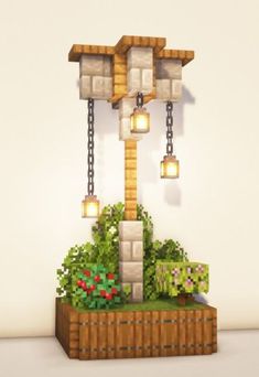 an image of a clock made out of lego blocks and chains with flowers in the foreground